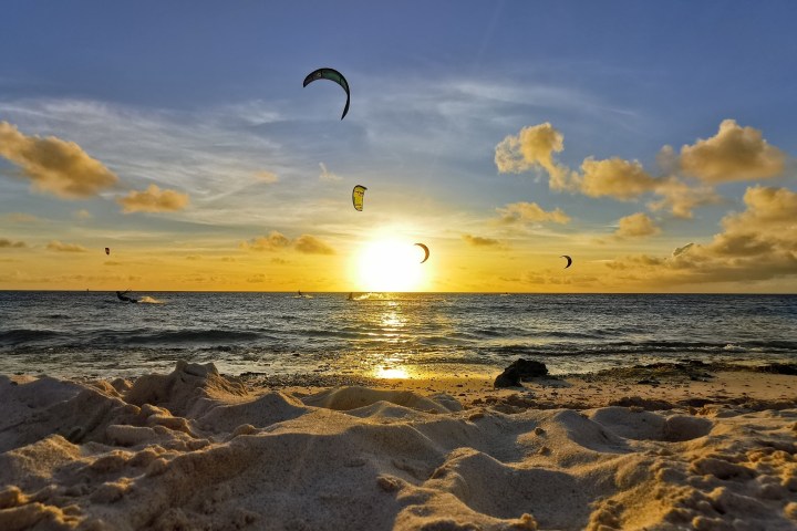 a group of people kite surfing