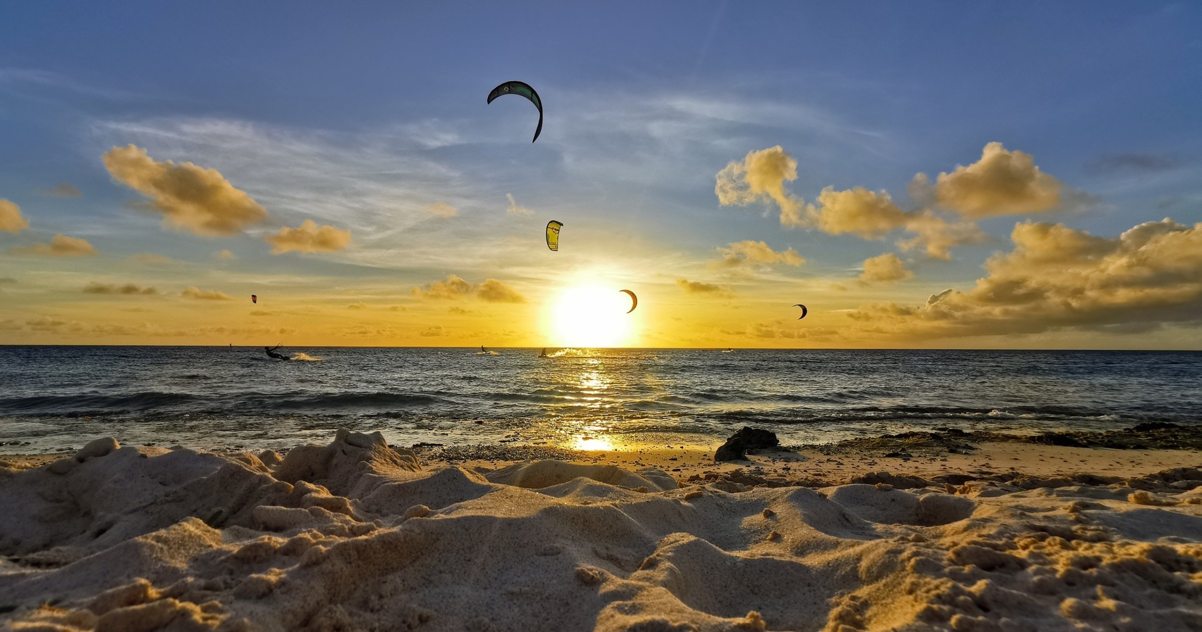 a group of people kite surfing